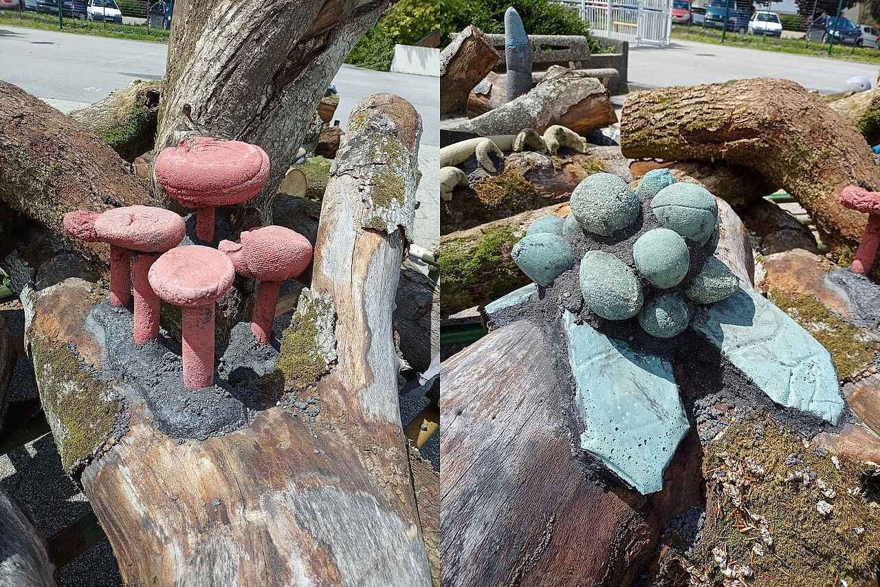 Deux détails de champignons en argile verte et rouge sur des troncs d'arbres.